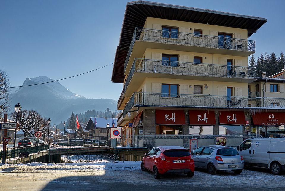The Rhodos building in winter, with the mountains behind